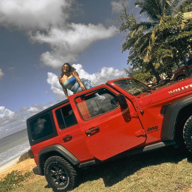 Beep-Beep-Jeep-Rental-Puerto-Rico-Woman-Posing-In-Front-Of-Her-Jeep